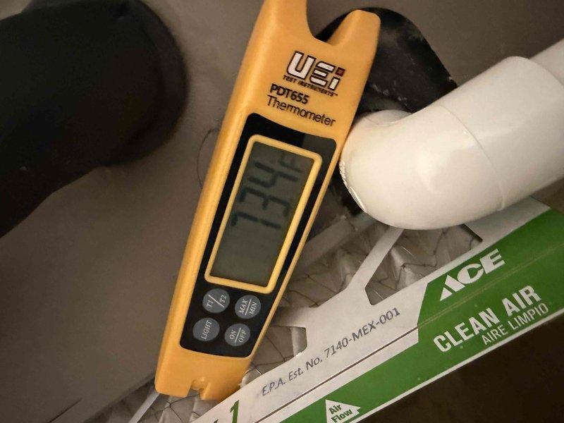 Completed comprehensive clean and check maintenance on air conditioning and air handler system as part of annual comfort plan service. Customer reported discovering water on floor upon returning from vacation, possibly condensation-related. Performed thorough inspection of condensate drain system, verified proper drainage function, and checked for potential overflow or leak sources. Inspected all electrical components, control boards, and wiring connections within air handler cabinet. Replaced air filtration media with new ACE Clean Air filter. Verified all system controls, safety devices, and operational parameters using calibrated digital thermometer. System operating within manufacturer specifications at completion of service.