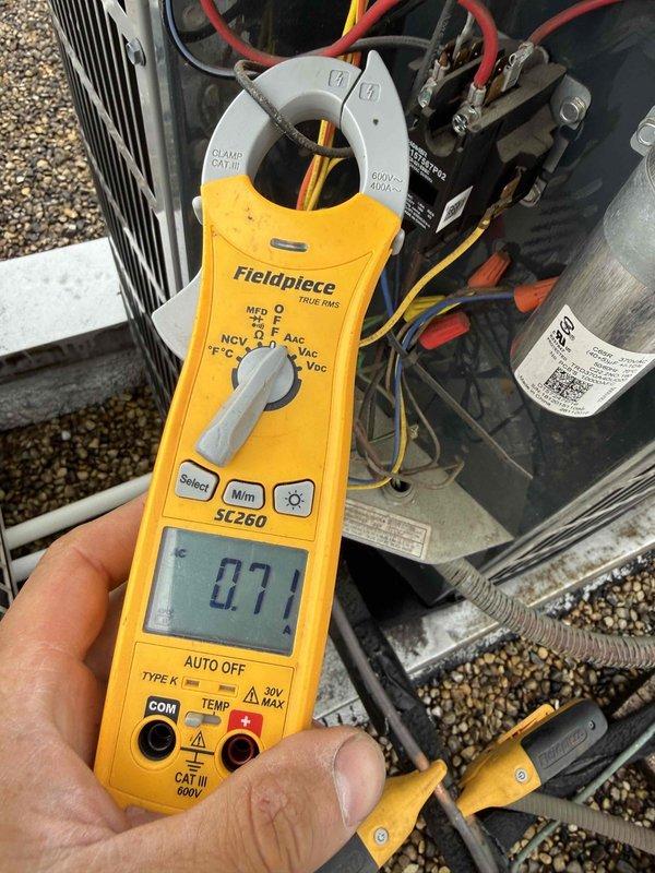 Completed comprehensive Gold Clean and Check maintenance service on rooftop HVAC system per comfort plan agreement. Coordinated roof access with building management, performed thorough inspection and cleaning of air conditioning condenser unit and air handler. Verified electrical performance using clamp meter, recording amperage readings to confirm system operating within manufacturer specifications. All components found in normal operational condition with routine weathering consistent with outdoor installation. System tested and left in proper working order.
