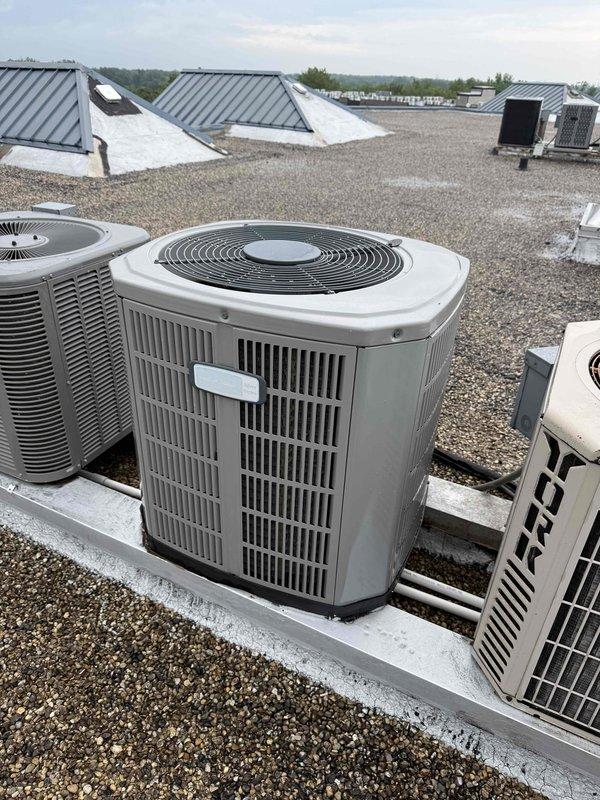 Completed comprehensive Gold Clean and Check maintenance service on rooftop HVAC system per comfort plan agreement. Coordinated roof access with building management, performed thorough inspection and cleaning of air conditioning condenser unit and air handler. Verified electrical performance using clamp meter, recording amperage readings to confirm system operating within manufacturer specifications. All components found in normal operational condition with routine weathering consistent with outdoor installation. System tested and left in proper working order.