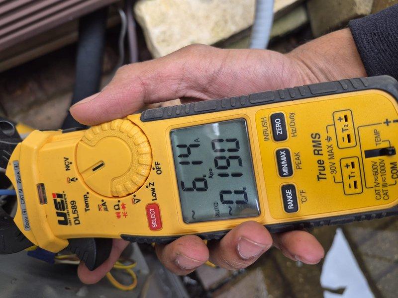 Performed comprehensive clean and check maintenance on single air conditioning system per service contract plan. Conducted electrical diagnostics using clamp meter to verify proper amperage draws and system performance. Confirmed thermostat operation showing system cooling at 74°F in proper working condition.