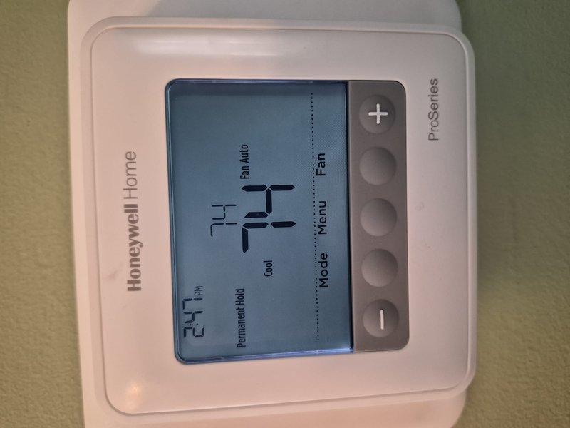 Performed comprehensive clean and check maintenance on single air conditioning system per service contract plan. Conducted electrical diagnostics using clamp meter to verify proper amperage draws and system performance. Confirmed thermostat operation showing system cooling at 74°F in proper working condition.