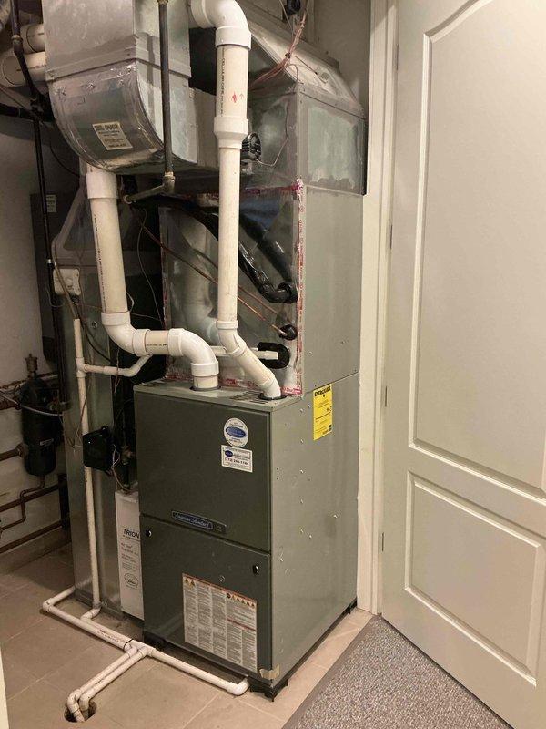 Completed full HVAC system replacement on first floor, including reclamation of existing refrigerant from old condenser, coil, and copper line-set prior to disconnection and disposal. Installed new Lennox 5-ton 22 SEER2 air conditioning condensing unit (Model EL22KCV-060-230) on rooftop location with new pad and vibration isolation pads, along with new evaporator coil connected to existing copper refrigerant lines. System was evacuated to remove moisture and air, then charged with R454B refrigerant per manufacturer specifications. Installed Refrigerant Detection System (RDS) for safety compliance. Crane services were utilized for removal of old equipment from roof and installation of new condensing unit. Upon completion, performed full system start-up, operational testing, adjustment of all components, and comprehensive safety inspection to ensure proper function. Unit is now operating within normal parameters with 10-year parts warranty and 10-year extended labor agreement in effect.