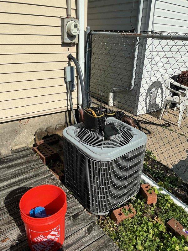 Completed spring preventive maintenance and clean and check service on outdoor air conditioning condensing unit per comfort plan agreement. Performed comprehensive system inspection, cleaned condenser coil, verified electrical connections, checked refrigerant pressures, measured supply air temperature at 69.9°F confirming proper cooling operation, and documented equipment condition with photos.