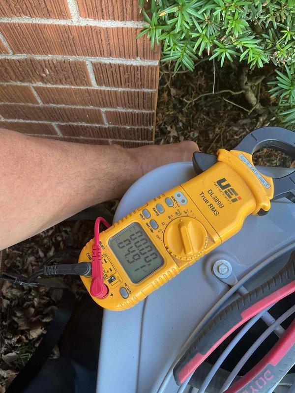 Completed comprehensive clean and check maintenance service on outdoor air conditioning system per comfort plan agreement. Performed standard inspection procedures including electrical testing with digital clamp meter to verify proper amperage draw and system performance. Unit found operating within normal parameters with all components functioning as designed.