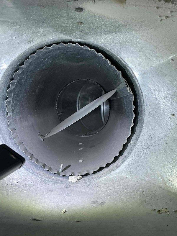 Completed comprehensive duct cleaning service for single-system condo unit, including thorough cleaning of main supply trunk lines and branch ducts. Accessed and cleaned rectangular main duct trunk showing accumulated dust and debris along interior surfaces, utilizing specialized rotary brush equipment and negative air pressure system with flexible extraction hose. Inspected and serviced round branch duct connections with damper mechanisms, removing built-up particulate matter from interior surfaces and damper blades to restore proper airflow and system efficiency.