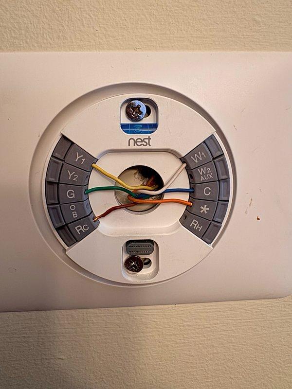 Responded to service call for reported electrical issues with Nest thermostat. Upon arrival, inspected thermostat wiring and connections at wall plate, verifying proper wire placement at Y1, Y2, G, O/B, Rc, W1, W2, AUX, C, and RH terminals. Evaluated thermostat functionality and power supply from HVAC system, checked C-wire connection for adequate 24V power delivery, and assessed overall system communication between thermostat and furnace unit in basement.