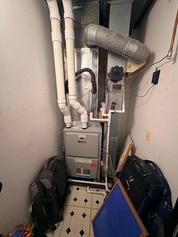 # HVAC Tune-Up Completed - Two System Service

Performed comprehensive preventive maintenance tune-up on a two-system HVAC setup consisting of an outdoor heat pump unit and an indoor gas furnace with air handler. Outdoor heat pump unit was accessed and inspected with top panel removed to evaluate internal components including compressor, refrigerant lines, electrical connections, and fan motor assembly. Indoor furnace system located in utility closet was inspected including ductwork connections, PVC condensate drainage lines, electrical controls, and air handling components.

Both systems were serviced according to standard preventive maintenance protocols. All mechanical and electrical components were found to be operating within normal parameters. Systems tested and confirmed operational upon completion of tune-up service.