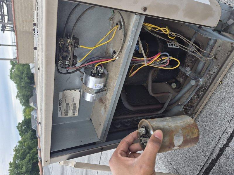 Responded to service call for outdoor HVAC unit experiencing operational issues. Upon inspection, identified a heavily corroded and failed 45/5 dual run capacitor that had sustained significant rust damage from prolonged exposure to outdoor elements and moisture. Removed the deteriorated capacitor from the electrical compartment and installed a new replacement capacitor to restore proper system functionality. Verified all electrical connections were secure, tested unit operation, and confirmed system returned to normal performance parameters.