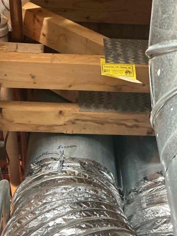 Completed air conditioning tune-up and maintenance on single system. Performed system diagnostics using digital testing equipment to verify operational parameters. Identified and documented air filter requiring replacement per maintenance code 108974. Inspected ductwork installation in attic space and mechanical equipment including water heater connections. System evaluated and customer notified of filter replacement needs.