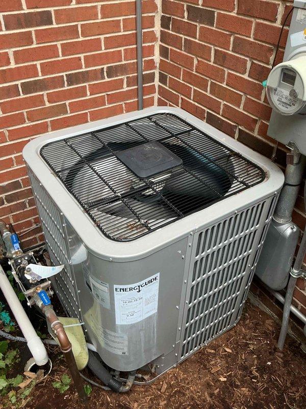 Responded to no cooling call on EnerGuide air conditioning system installed in 2021. Upon arrival, performed diagnostic evaluation of outdoor condenser unit and indoor air handler components. Verified thermostat settings, checked electrical breakers, and inspected air filter condition. Measured supply air temperature at indoor unit registering 50.5°F, indicating system was producing cooling. Inspected outdoor condenser unit installation including refrigerant line connections with service valves, electrical conduit, and PVC condensate drain routing. All major components including compressor, condenser fan, and evaporator coil found operational. System appeared to be functioning within normal parameters at time of service. Documented equipment information and captured photographs of outdoor unit installation and temperature measurements for service records. Unit remains under manufacturer warranty coverage.