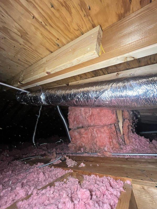 Completed ductwork installation in attic space, including capping off the existing return air opening in the wall. Installed new 4-inch insulated flexible duct from exhaust fan to roof vent with proper support strapping throughout the run to ensure code compliance and prevent sagging. All materials were staged and pulled from inventory as specified, with installation completed per manufacturer specifications.