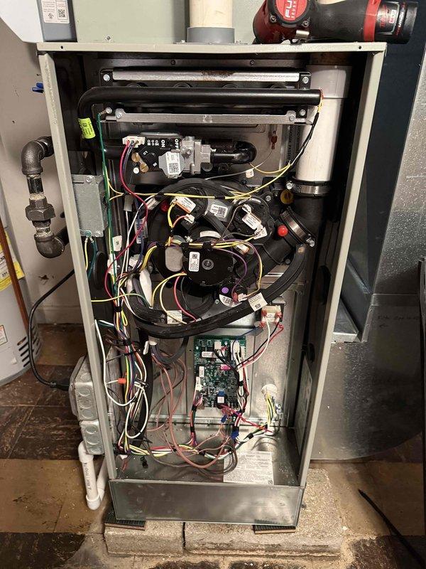 Completed Comfort Plan Clean and Check maintenance on single HVAC system. Performed comprehensive inspection and cleaning of outdoor condenser unit, including coil cleaning with pressure washing equipment to remove debris and vegetation buildup. Inspected indoor heating system components, verified proper operation of circulator pumps, control board functionality, and electrical connections. Noted that access panel was damaged and dislodged during recent storm; secured unit for continued safe operation.