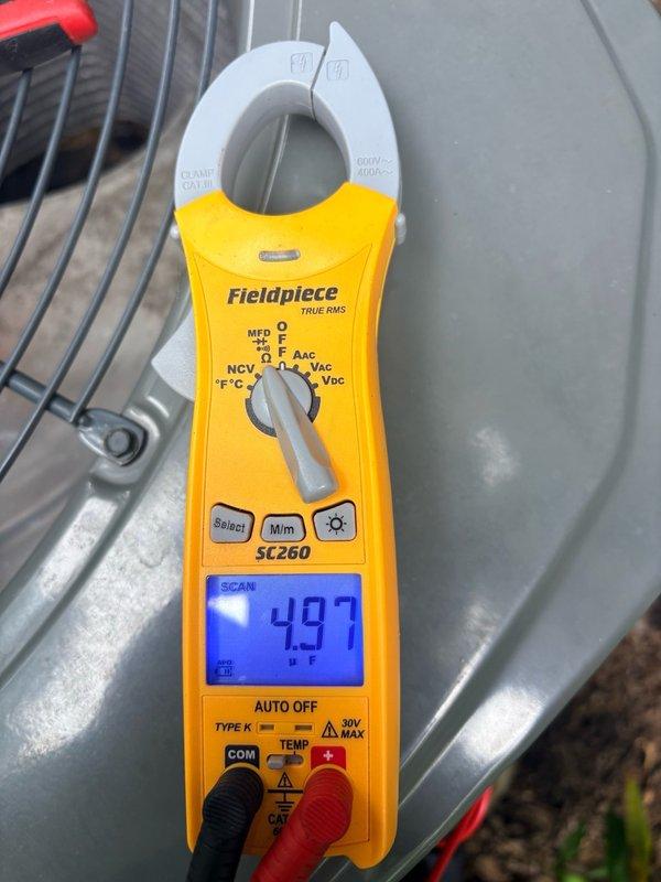 Completed comprehensive clean and check maintenance on two air conditioning systems with two Unico air handlers serving the first and second floors. Performed electrical diagnostics using digital multimeter, recording voltage and capacitance readings to verify proper system operation. Both units found to be operating within normal parameters with all components functioning correctly.
