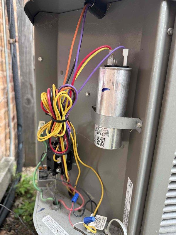 Completed spring maintenance clean and check on one air conditioning system per Comfort Plan agreement in response to customer concern about home temperature rising. Removed accumulated organic debris including twigs, dried grass, and plant material from outdoor unit housing, inspected electrical connections and wiring harness, verified capacitor condition and mounting, and confirmed all components operating within normal parameters. System restored to optimal performance with improved airflow and cooling capacity.