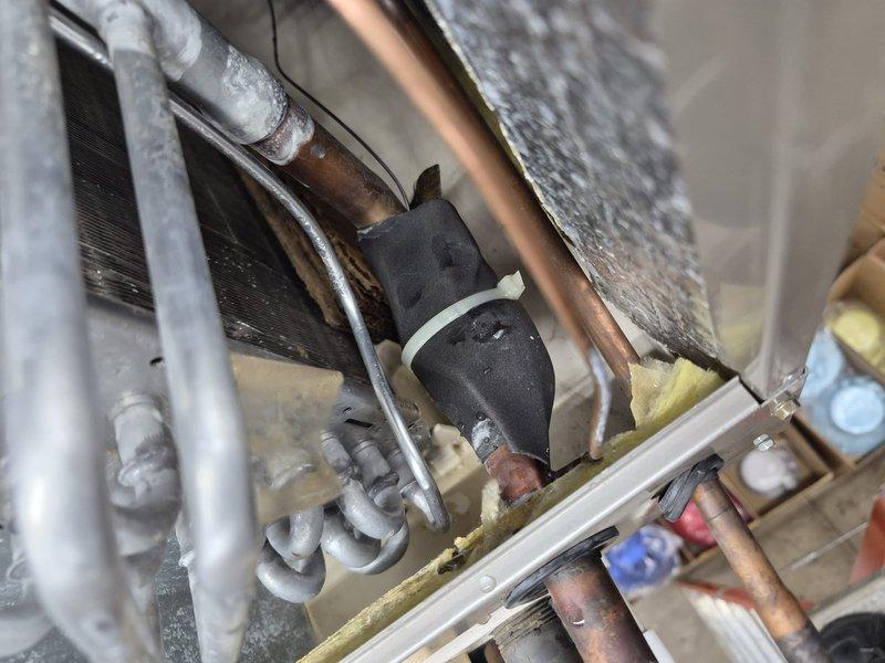 Completed spring preventive maintenance on commercial air conditioning unit per customer care plan. Performed thorough cleaning and inspection of system components, verified thermostat operation showing 75°F setpoint with proper cooling mode functionality. Observed significant frost accumulation on evaporator coil and refrigerant lines during inspection, indicating potential airflow restriction or refrigerant charge issue requiring further diagnostic evaluation.