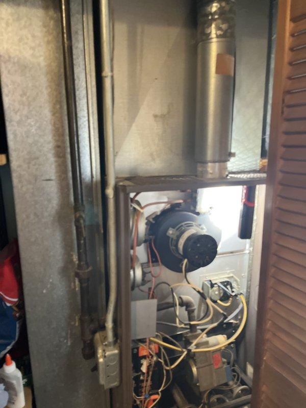 Completed comprehensive estimate for full HVAC system replacement on 25-year-old equipment. Current furnace and air conditioning condenser are operational but nearing end of service life. Assessed existing outdoor condenser unit positioned against exterior brick wall and inspected interior furnace cabinet components including blower motor assembly and control wiring. Provided high-efficiency system upgrade options to improve energy performance and reliability.