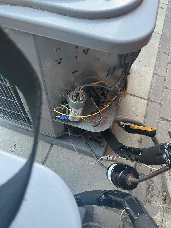 Responded to no cooling call on residential air conditioning system. Upon arrival, found unit not operating due to failed capacitor. Inspected outdoor condensing unit and confirmed capacitor failure through visual inspection and electrical testing. Replaced defective capacitor with new component and restored system to proper operation. Additionally, replaced dirty 16x25x1 air filter at attic access point, as unit had not received regular maintenance. Tested system operation and verified proper cooling function. Discussed importance of routine maintenance to prevent future breakdowns and recorded all equipment information for service records.