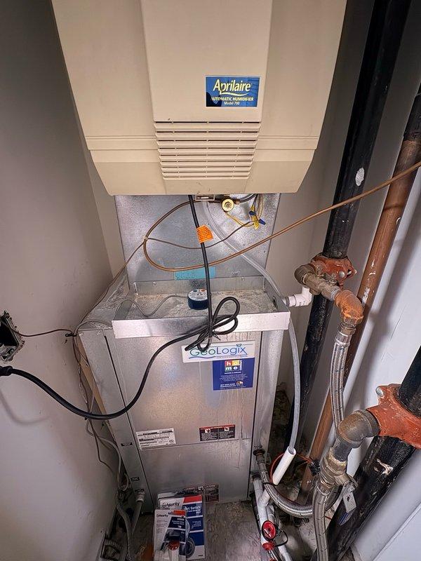 Installed wet switch on floor in front of heat pump unit to kill power when tripped, providing overflow protection for the system. Added float switch with T-fitting at humidifier drain line connection to shut down humidifier power in the event of drainage issues, preventing potential water damage to the mechanical closet and equipment.