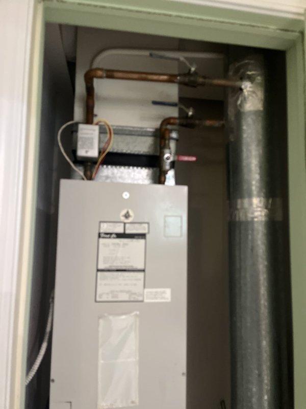 Conducted on-site evaluation for complete AC system replacement. Customer seeking alternate contractor due to equipment procurement delays with previous company. Assessed existing HVAC installation including tankless water heater configuration and current Honeywell programmable thermostat. Documented equipment locations, utility closet layout with existing copper piping infrastructure, and electrical connections. Photographed installation area to determine equipment compatibility and access requirements for replacement unit. Provided comprehensive estimate for expedited AC system installation with timeline for equipment procurement and installation scheduling.