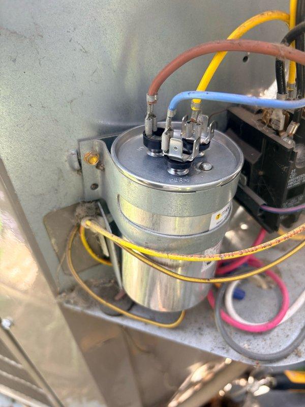 Responded to no cooling call on 8-year-old residential air conditioning system. Upon inspection, diagnosed failed capacitor as cause of system failure. Replaced defective capacitor with new unit, verified proper electrical connections, and restored cooling operation to entire home. System tested and confirmed functioning within normal operating parameters.