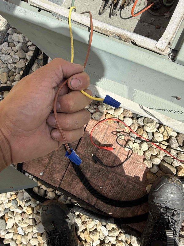 Responded to no cooling complaint on residential air conditioning system. Upon arrival, verified compressor was not engaging and performed diagnostic testing on outdoor condensing unit. Identified failed dual run capacitor exhibiting severe corrosion and terminal deterioration. Removed defective capacitor and tested electrical connections to confirm proper voltage supply. Replaced failed capacitor with new component, restored system operation, and verified compressor engagement and proper cooling cycle functionality.