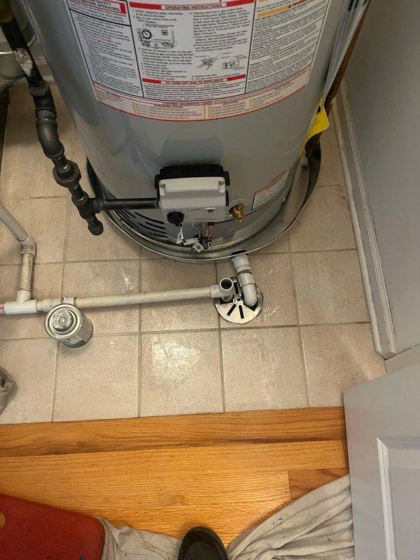 Successfully installed a new 50-gallon residential tanked water heater in the utility closet. The unit was positioned on the existing drain pan with proper plumbing connections completed, including hot and cold water lines, TPR valve discharge piping, and gas supply line. All manufacturer safety labels and operational instructions remain visible and intact per code requirements.