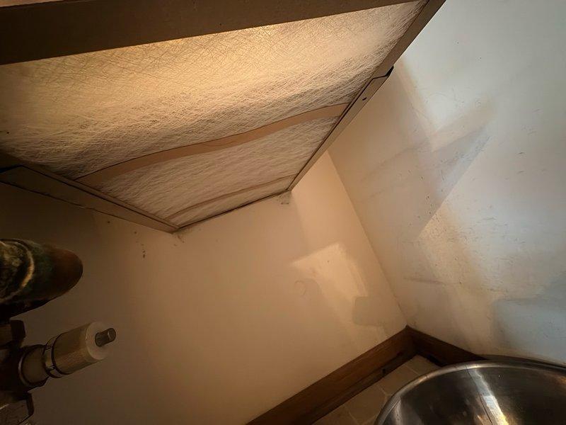 Responded to no cooling call at commercial property. Accessed rooftop HVAC unit and removed access panel to inspect internal components and coil assembly. Checked indoor air handler in attic space and inspected condensate drain system. Photographed equipment conditions and performed diagnostic assessment to determine cause of cooling failure.