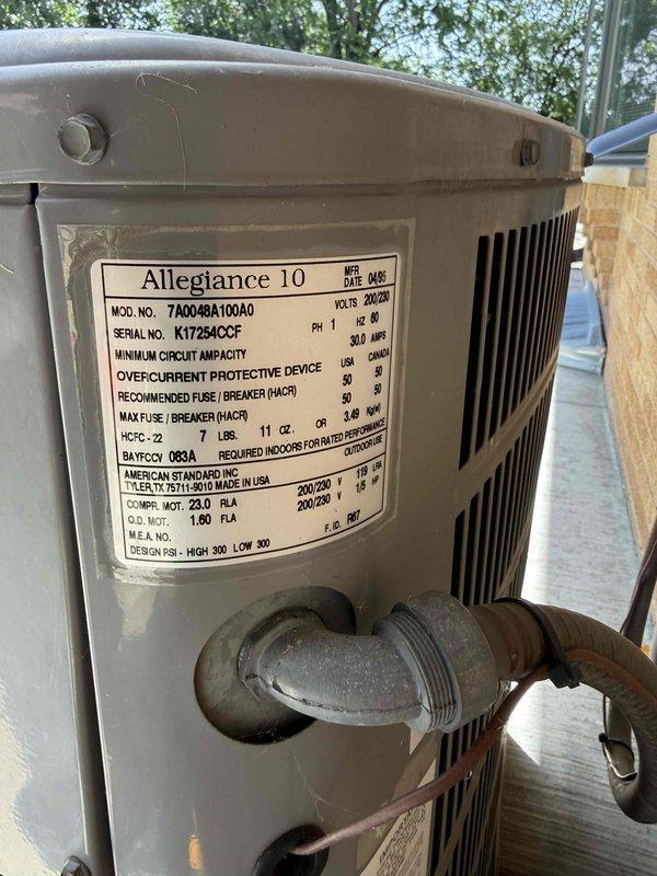 Responded to no cooling complaint on American Standard Allegiance 10 system (Model 7A0048A100A0, Serial K17294CCEF). Performed standard diagnostic evaluation of outdoor condensing unit and indoor air handler, verified thermostat settings, checked system breakers, and inspected air filter condition. Documented equipment information and captured photographic records of both indoor furnace/air handler installation and outdoor condensing unit for service file.