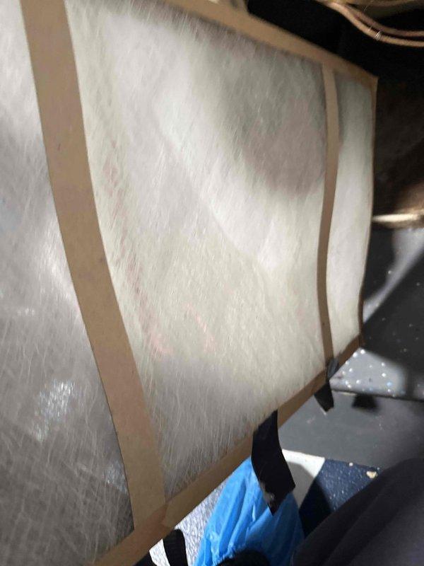 Responded to service call for non-operational air conditioning unit with reported burning rubber odor. Accessed mechanical room and conducted thorough inspection of HVAC system components, ductwork, and insulation. Documented existing conditions of equipment including insulated sections, ventilation connections, and mechanical unit mounting with photographic evidence for maintenance records.