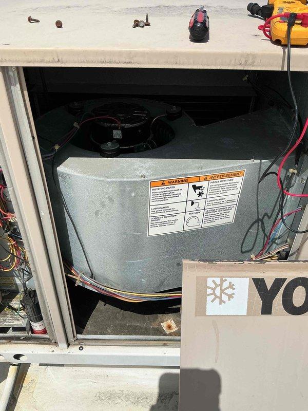 Returned to address ongoing cooling issue with rooftop unit serving office space. Upon inspection, found blower motor assembly required replacement due to failure. Removed defective motor from housing, installed new motor unit with proper mounting and electrical connections, and verified system operation with successful cooling restoration.