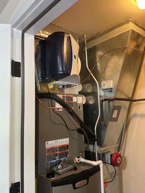 Completed full HVAC system replacement including disconnection and disposal of existing forced air furnace and air conditioning system. Installed new Lennox 97% AFUE 110,000 BTU two-stage variable speed forced air furnace (Model EL297UH110XV48CK) with connections to existing supply and return ductwork, gas line, electrical circuit, and exhaust system. Reclaimed refrigerant from old A/C system and installed new Lennox 3.5 ton single-stage air conditioning condensing unit (Model EL16KC1-036-230) on new pad at existing rooftop location. Installed new evaporator coil and connected to existing copper refrigerant lines. Evacuated system to remove moisture and air, then charged with R454B refrigerant to manufacturer specifications. Performed complete system startup, testing, adjustment, and safety inspection on all equipment to verify proper operation. All components functioning within normal parameters upon completion.