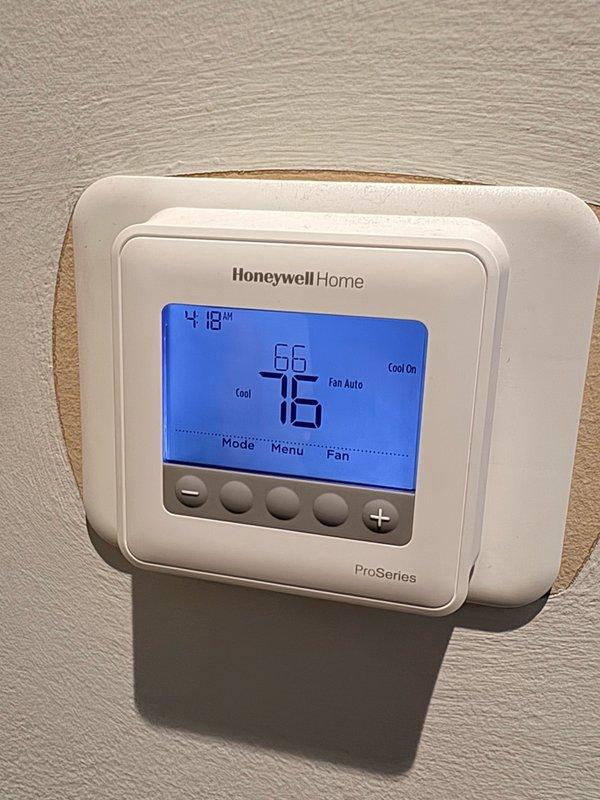Responded to no cooling complaint on residential air conditioning system. Upon arrival, found thermostat displaying 76°F current temperature with cooling setpoint at 66°F, indicating a 10-degree temperature differential. Verified thermostat was properly set to cooling mode with fan set to auto operation. Inspected supply air vent and confirmed airflow present at register. Performed diagnostic evaluation of system operation, checked air filter condition, and verified electrical supply at breaker panel.