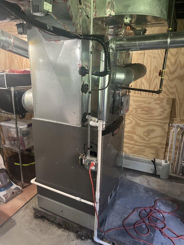 Responded to service call for residential air conditioning system with reported compressor failure. Performed comprehensive diagnostic evaluation of HVAC system located in basement utility area. Inspected furnace unit, air handler, ductwork connections, and associated mechanical components. Assessed refrigerant system, electrical connections, and overall equipment condition to determine extent of compressor malfunction and provided estimate for repair or replacement options to restore cooling functionality.