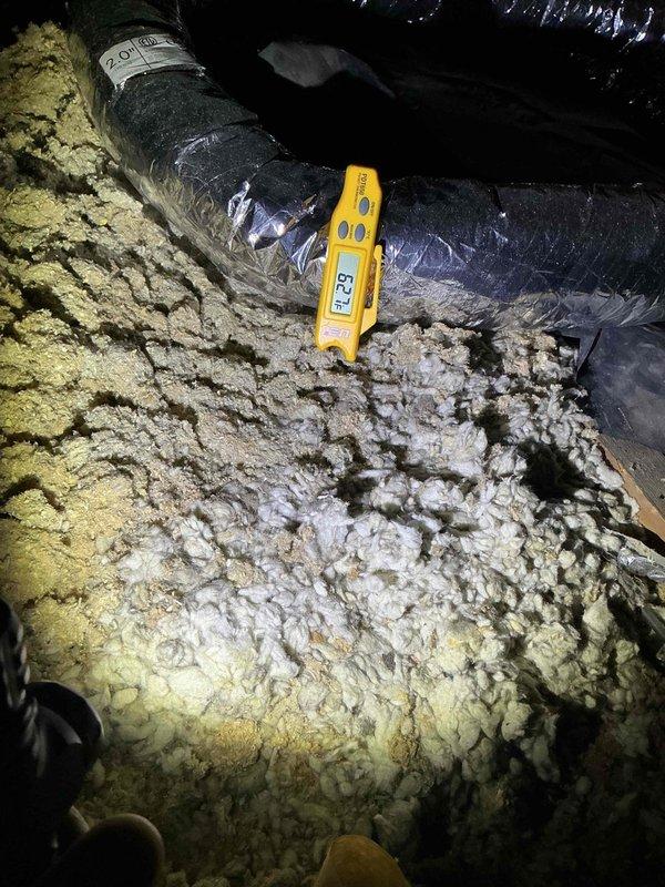 Responded to callback regarding non-operational compressor one day after completing warranty service on attic-mounted air handler system. Upon inspection, verified air handler installation including suspended unit with multiple insulated flex duct branches, condensate drain pan, and PVC drain lines. Conducted diagnostic measurements and system evaluation to determine if compressor issue was related to previous warranty work or represented a new failure requiring separate attention.