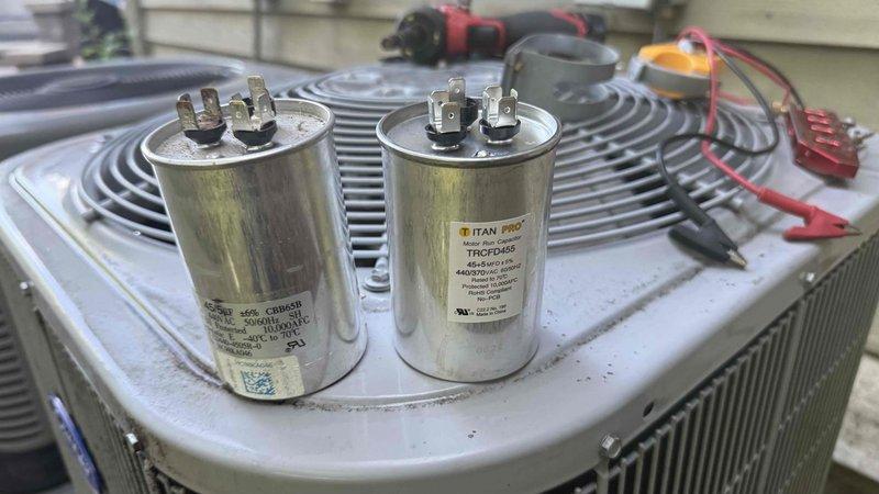 Responded to no cooling complaint on Carrier condensing unit. Upon arrival, confirmed compressor operation but inadequate cooling performance. Diagnosed failed dual-run capacitor causing reduced system efficiency and inability to maintain proper cooling cycle. Replaced defective capacitor with new Titan Pro TRCFD455 unit, restoring proper electrical values to compressor and condenser fan motor. Verified system operation, confirmed proper amperage draw, and tested cooling performance. Unit now operating within manufacturer specifications and delivering cold air as designed.