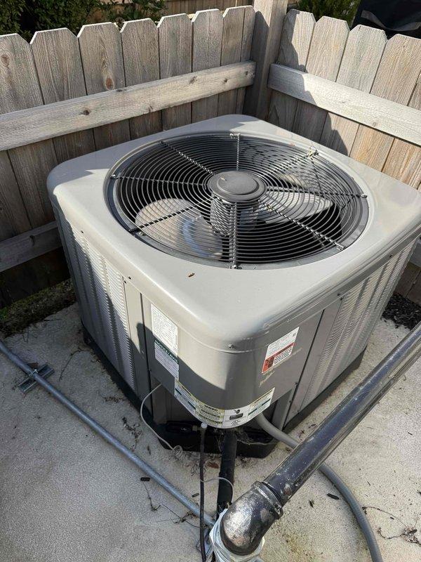 Responded to customer complaint of excessive indoor humidity despite air conditioning operation. Upon inspection, discovered heavy frost accumulation on refrigerant suction line in mechanical room, indicating restricted airflow or low refrigerant charge. Documented frozen evaporator coil condition with photographic evidence. Inspected outdoor condenser unit and verified operational status. Diagnosed system airflow restriction causing coil icing and subsequent humidity control issues. Collected equipment information for service records and discussed preventative maintenance options with customer.