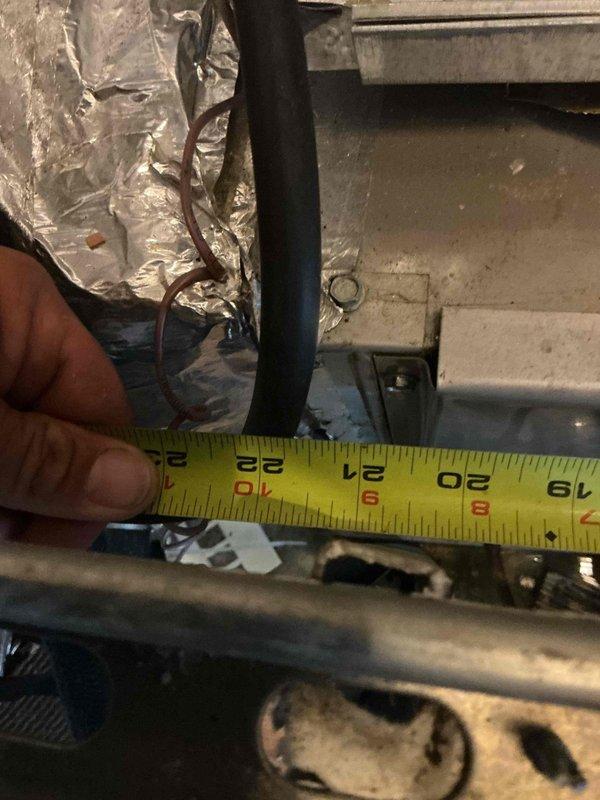 Responded to no cooling complaint on 10-15 year old rooftop unit. Upon arrival, performed visual inspection of indoor air handler and associated ductwork in mechanical room. Measured refrigerant line sizing to verify proper installation specifications. Inspected condition of furnace/air handler unit, noting age-related wear on insulation and PVC condensate drainage system. Evaluated overall system components including ductwork insulation, electrical connections, and drain lines for signs of leakage or deterioration. Documented equipment condition with measurements and photographic evidence for further diagnostic assessment and repair recommendations.