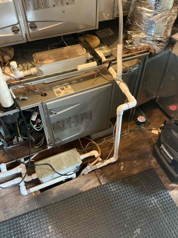 Responded to no cooling complaint on 10-15 year old rooftop unit. Upon arrival, performed visual inspection of indoor air handler and associated ductwork in mechanical room. Measured refrigerant line sizing to verify proper installation specifications. Inspected condition of furnace/air handler unit, noting age-related wear on insulation and PVC condensate drainage system. Evaluated overall system components including ductwork insulation, electrical connections, and drain lines for signs of leakage or deterioration. Documented equipment condition with measurements and photographic evidence for further diagnostic assessment and repair recommendations.