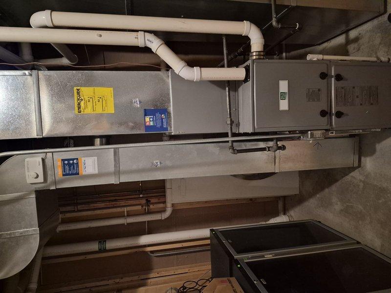 Completed spring clean and check maintenance on three-system HVAC comfort plan. Performed comprehensive inspection of furnace unit in basement mechanical room, verifying operational status of all components, electrical connections, and safety controls. Cleaned condenser coils which showed moderate dust, debris, and cobweb accumulation, restoring optimal heat transfer efficiency. Verified proper drainage system function, inspected all ventilation connections, and confirmed equipment is operating within manufacturer specifications for the upcoming cooling season.