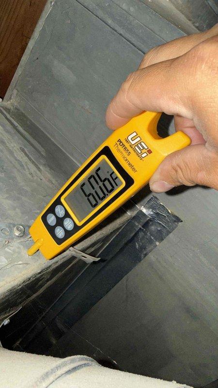 Responded to no cooling complaint on residential air conditioning system. Upon inspection, diagnosed failed dual run capacitor with visible corrosion on terminal cap and tested electrical readings confirming capacitor failure. Replaced defective capacitor, verified proper voltage and amperage readings at compressor and blower motor, and confirmed system returned to normal cooling operation.