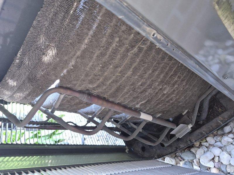 Responded to no-cooling complaint on 3-year-old Trane AC unit. Upon inspection, found outdoor condenser coil heavily obstructed with dust, dirt, and debris accumulation, severely restricting airflow and reducing heat transfer efficiency. Performed thorough coil cleaning to restore proper airflow and system performance. Unit tested and confirmed operational with normal cooling capacity restored.