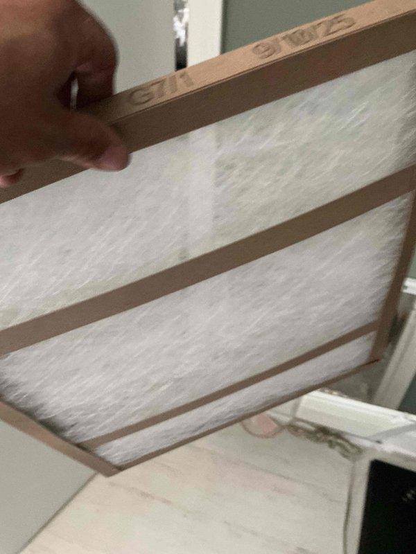 Responded to no cooling complaint on second floor unit with indoor temperature at 94 degrees. Upon arrival, verified thermostat set to 72 degrees in cooling mode with system blowing warm air. Performed diagnostic evaluation of outdoor condenser unit and indoor air handler. Inspected refrigerant lines, electrical connections, and compressor operation. System exhibited signs consistent with aging equipment over 10 years old. Documented equipment information and captured photos of outdoor unit installation showing dual condenser setup with proper clearances and electrical disconnects. Completed thorough assessment and discussed repair options and replacement considerations given age of equipment.