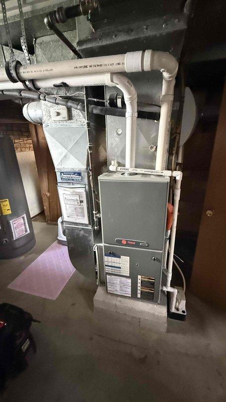Responded to no cooling call on 2018 Lennox air conditioning system. Upon arrival, performed diagnostic evaluation of system including thermostat settings verification, air filter inspection, electrical breaker check, and temperature measurements at supply ductwork. Documented equipment information and captured photos of furnace installation and diagnostic temperature readings during service call. Discussed available service options and maintenance plan with new customer.