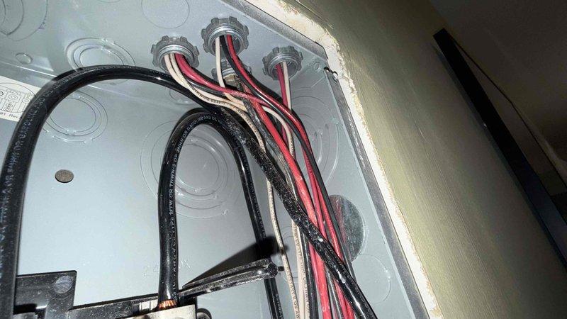 Responded to no-cooling call on air conditioning system installed in 2020. Upon arrival, inspected electrical connections at junction box and discovered wiring issues that were preventing proper system operation. Traced electrical fault to outdoor unit on roof where deteriorated conduit and compromised wiring connections were identified. Documented electrical deficiencies with photos for warranty review and provided customer with repair options to restore system functionality.