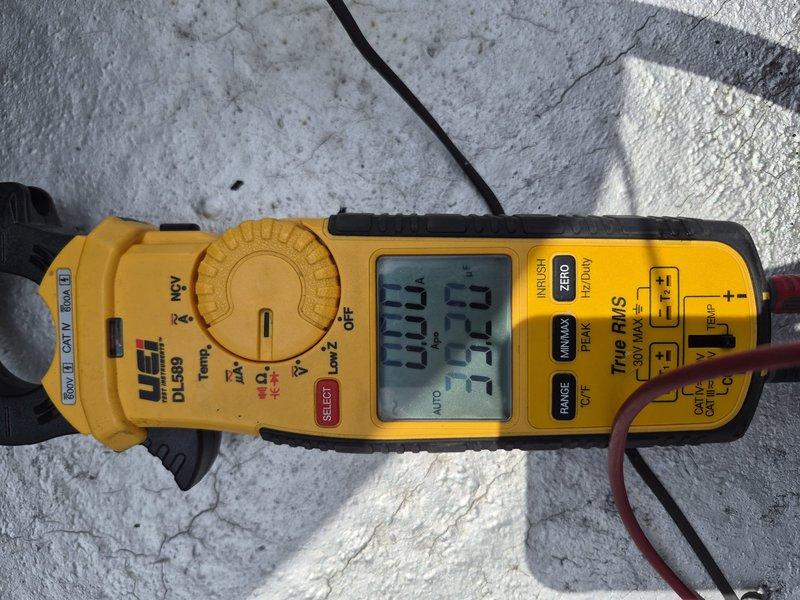 Responded to no cooling call at residential property. Upon arrival, accessed outdoor condensing unit located approximately 8 feet high requiring ladder access. Performed diagnostic testing using digital clamp meter to assess electrical components and system operation. Inspected indoor air handler unit and associated ductwork in mechanical closet. Identified system failure and discussed repair options with customer. Documented equipment information and captured diagnostic photos for service records.