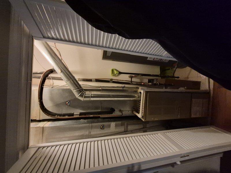 Responded to no cooling call at residential property. Upon arrival, accessed outdoor condensing unit located approximately 8 feet high requiring ladder access. Performed diagnostic testing using digital clamp meter to assess electrical components and system operation. Inspected indoor air handler unit and associated ductwork in mechanical closet. Identified system failure and discussed repair options with customer. Documented equipment information and captured diagnostic photos for service records.