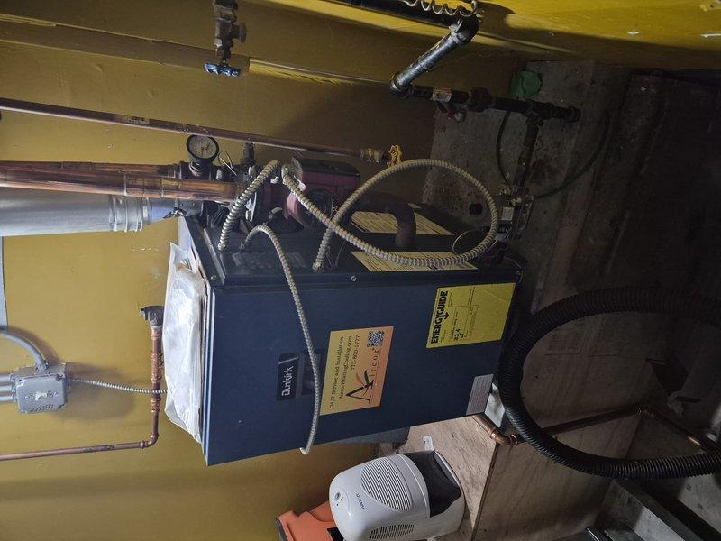 Responded to service call for water leak near furnace area. Upon arrival, conducted thorough inspection of heating equipment, surrounding piping, and mechanical room to identify source of water dripping onto floor. Examined all visible plumbing connections, condensate lines, pressure relief valve, and external water sources that could potentially affect the equipment area. Documented equipment conditions and potential leak sources with photographic evidence for further assessment.