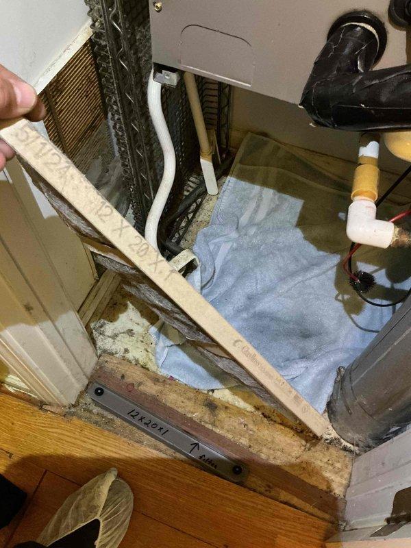 Responded to no cooling complaint with 7-degree temperature differential between thermostat setpoint and actual room temperature. Upon inspection, found Frigidaire air handler with severely contaminated evaporator coil restricting airflow and significantly reducing heat transfer capacity. Coil exhibited heavy accumulation of dust, dirt, and debris on fins and surfaces. Additionally, discovered extensive mold and algae growth in drain pan and surrounding interior compartment surfaces, indicating prolonged moisture issues and inadequate drainage. Performed thorough cleaning of evaporator coil to restore proper airflow and heat exchange efficiency. Cleaned and treated drain pan and interior surfaces to remove biological growth. Cleared condensate drain line to ensure proper moisture removal. Verified system operation after service; unit now cooling effectively with improved airflow and temperature control restored to normal parameters.
