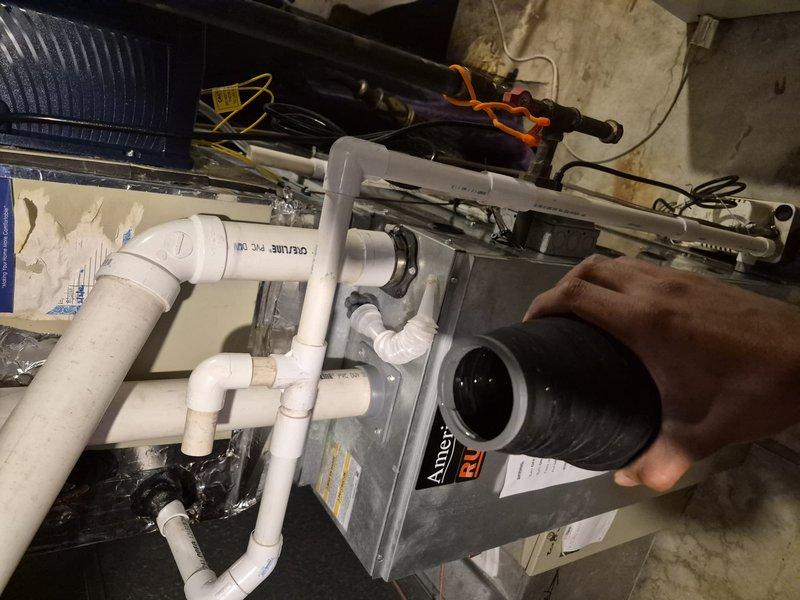 Completed annual air conditioning clean and check maintenance per service contract plan. Inspected evaporator coil and found moderate to heavy accumulation of dirt, dust, and debris on fins and heat transfer surfaces. Performed thorough cleaning of coil assembly to restore proper airflow and heat exchange efficiency. Inspected air handler unit, condensate drainage system with PVC piping, and associated ductwork. Verified all electrical connections, refrigerant lines, and system components are operating within normal parameters. System tested and confirmed operational upon completion of maintenance service.