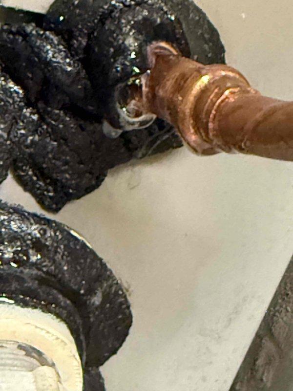 Responded to no cooling complaint at commercial office space where indoor temperature had risen to 84 degrees. Upon arrival, coordinated building access and conducted system evaluation. Inspected refrigerant lines and connections, documenting copper piping with visible patina and insulated refrigerant lines showing condensation. Followed required approval process by contacting office to coordinate authorization through property management for diagnostic and repair work.